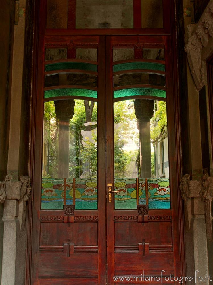 Milan (Italy) - Colored glass art nouveau door to the atrium of House Campanini